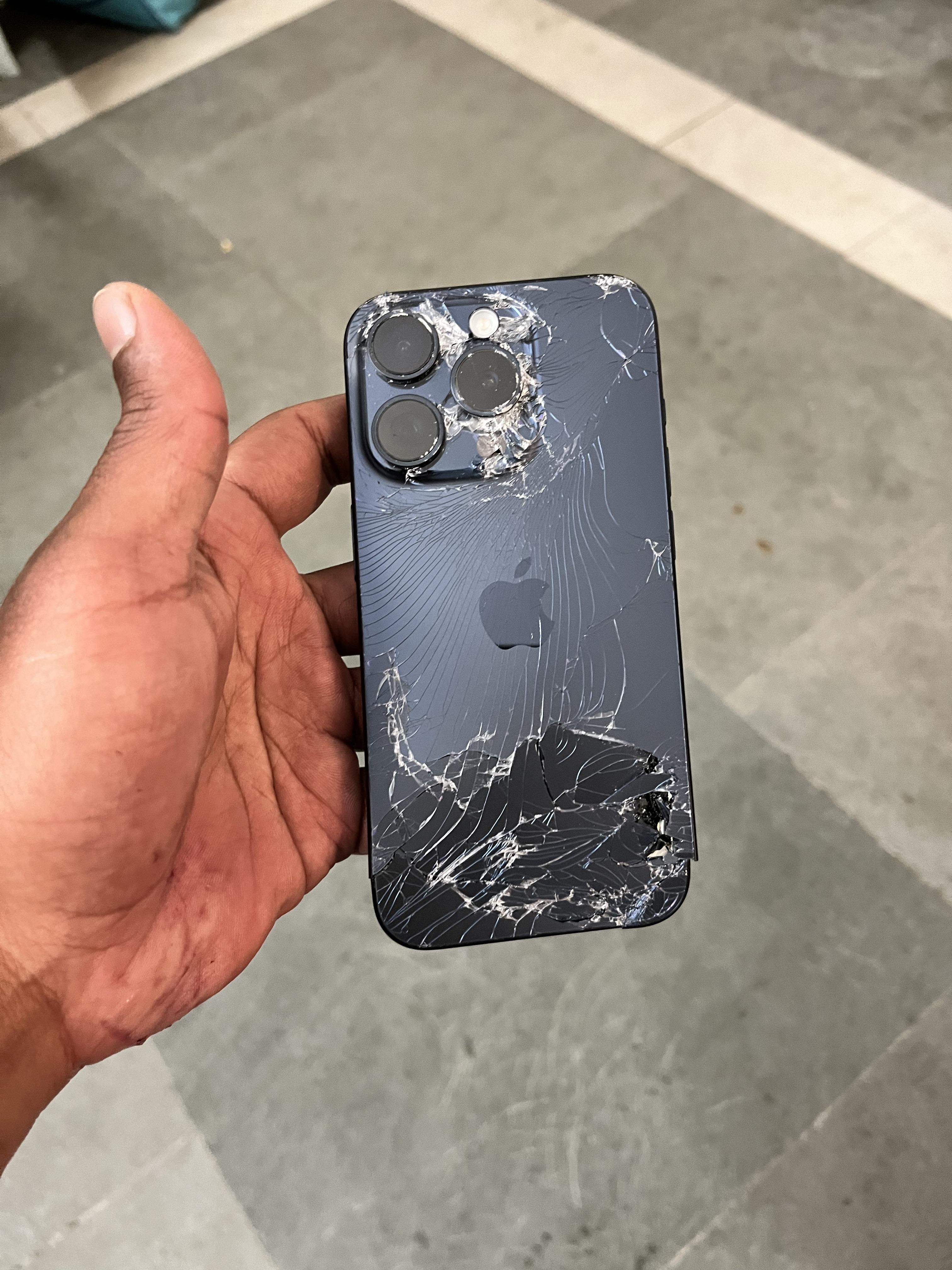Severely damaged phone before repair